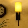 Devansh Metal Electric Wall Light in Black Colour with Yellow Shade Count of 1 Light