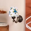 Devansh Metal Electric Wall Light in Antique Gold Colour with Multi Shade Count of 1 Light