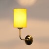 Devansh Metal Electric Wall Light in Gold Colour with Yellow Shade Count of 1 Light