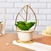Green Leafy Artificial Plant With White And Gold Ceramic Pot