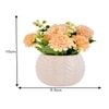 Artificial Flowers With A White Textured Planter