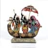 Desert Art Metal Handpainted Dancing Couple Boat Showpiece in Golden Finish