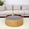 Ridgor Round Coffee Table In Golden Leafing With Glass Top