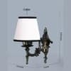 Devansh Metal Electric Wall Light in Antique Gold Colour with White & Black Shade Count of 1 Light