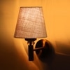 Devansh Metal Electric Wall Light in Gold Colour with Beige Shade Count of 1 Light
