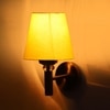 Devansh Metal Electric Wall Light in Gold Colour with Yellow Shade Count of 1 Light