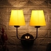 Devansh Metal Electric Wall Light in Gold Colour with White Shade Count of 2 Lights