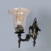 Devansh Metal Electric Wall Light in Antique gold Colour with Transparent Shade Count of 1 Light