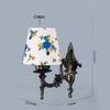 Devansh Metal Electric Wall Light in Antique Gold Colour with Multi Shade Count of 1 Light