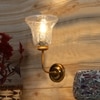 Devansh Metal Electric Wall Light in gold Colour with Transparent Shade Count of 1 Light