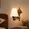 Devansh Metal Electric Wall Light in Gold Colour with off-white Shade Count of 1 Light