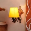 Devansh Metal Electric Wall Light in Antique Gold Colour with Yellow Shade Count of 1 Light