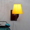 Devansh Solid Wood Electric Wall Light in Yellow Colour with Yellow Shade Count of 1 Light