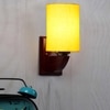 Devansh Solid Wood Electric Wall Light in Yellow Colour with Yellow Shade Count of 1 Light