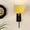 Devansh Metal Electric Wall Light in Black Colour with Yellow Shade Count of 1 Light