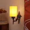Devansh Metal Electric Wall Light in Antique Gold Colour with Yellow Shade Count of 1 Light
