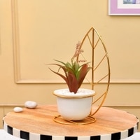 Red And Green Artificial Plant With White And Gold Ceramic Pot