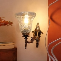 Devansh Metal Electric Wall Light in Antique gold Colour with Transparent Shade Count of 1 Light