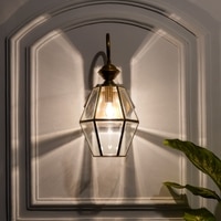 Guildhall  Single Arm Wall Light in Brass Finish