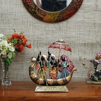 Desert Art Metal Handpainted Dancing Couple Boat Showpiece in Golden Finish
