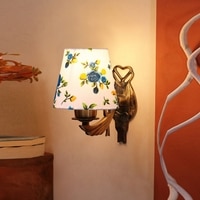 Devansh Metal Electric Wall Light in Antique Gold Colour with Multi Shade Count of 1 Light