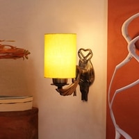 Devansh Metal Electric Wall Light in Antique Gold Colour with Yellow Shade Count of 1 Light