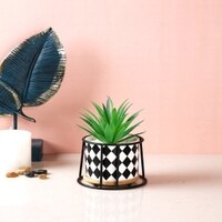 Highly Attractive Faux Plant With A Checkered Patterned Ceramic Pot In A Stand