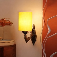 Devansh Metal Electric Wall Light in Antique Gold Colour with Yellow Shade Count of 1 Light