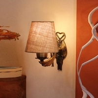 Devansh Metal Electric Wall Light in Antique Gold Colour with Beige Shade Count of 1 Light