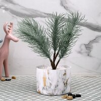 Attractive Faux Plant With White Ceramic Pot