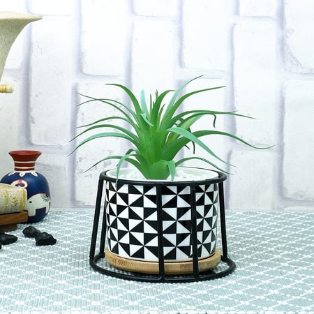 Highly Attractive Faux Plant With A Geometric Patterned Ceramic Pot In A Stand