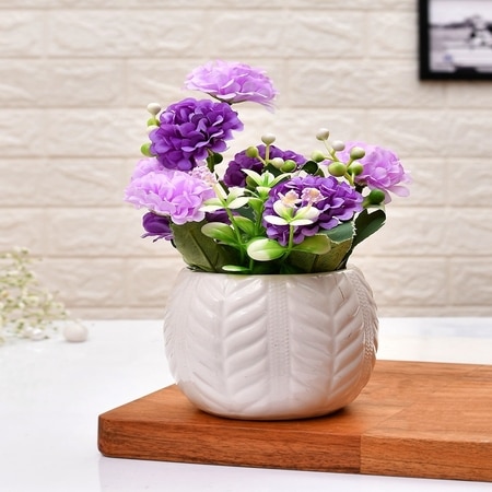 Artificial Lilac Hues Flowers With A White Textured Planter