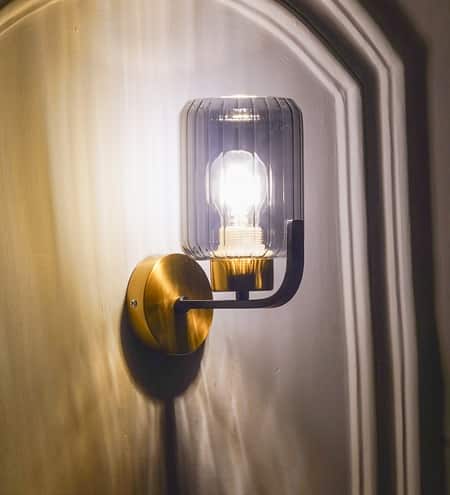 Isabella Single Light Wall Fitting In Black And Brass Finish Metal With Smoke Glass