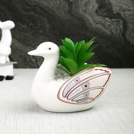 Aloe Vera Plant Inside An Artistic White Swan Ceramic Pot
