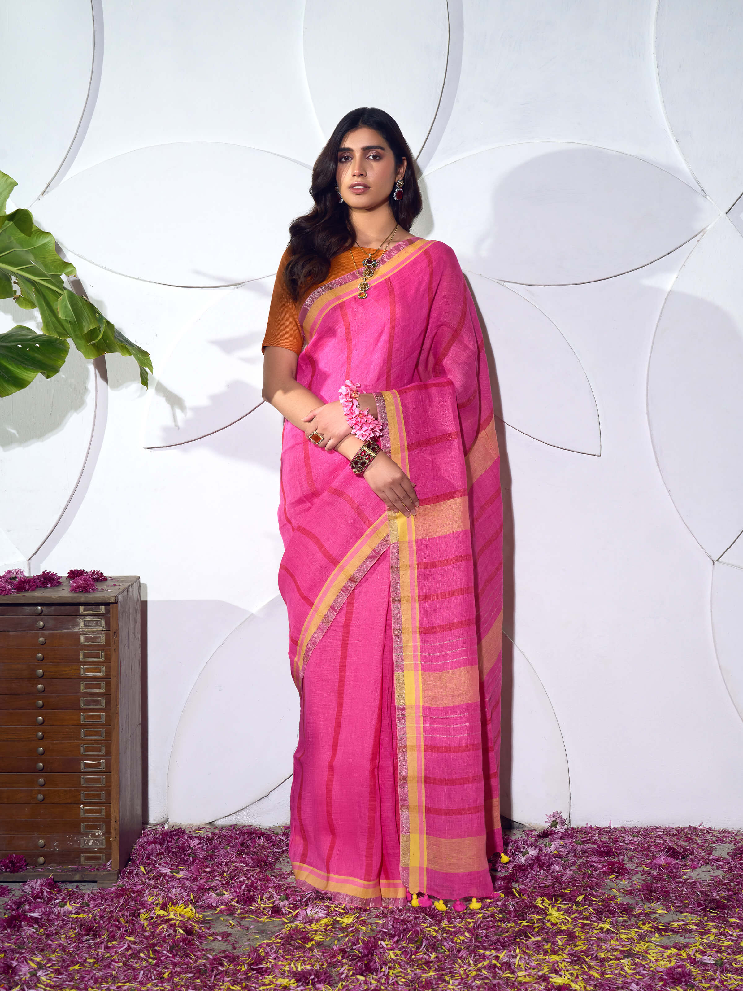 Side view of pink linen striped saree highlighting lightweight drape