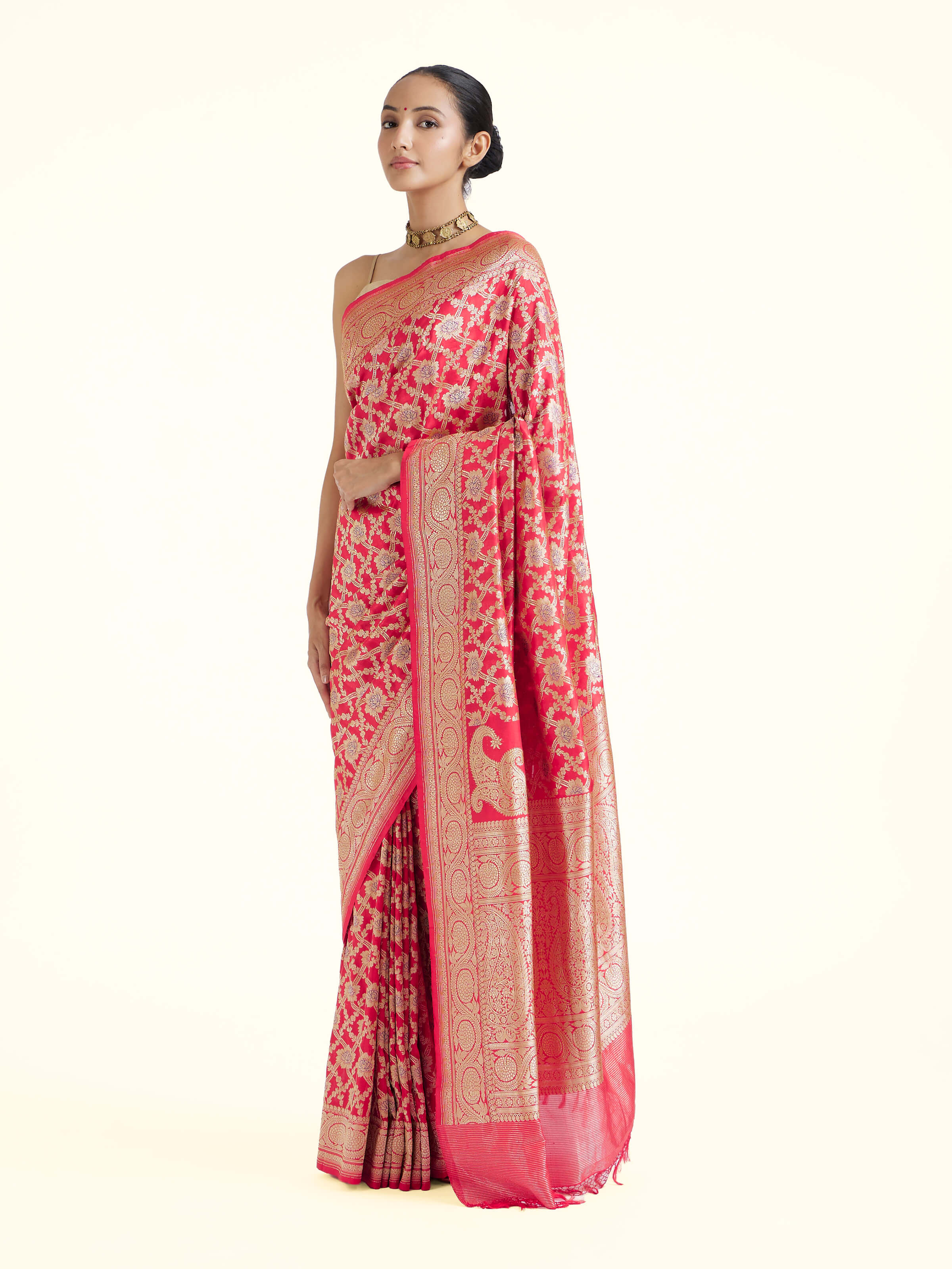 Side view of red mulberry katan silk Banarasi saree with elegant drape and border