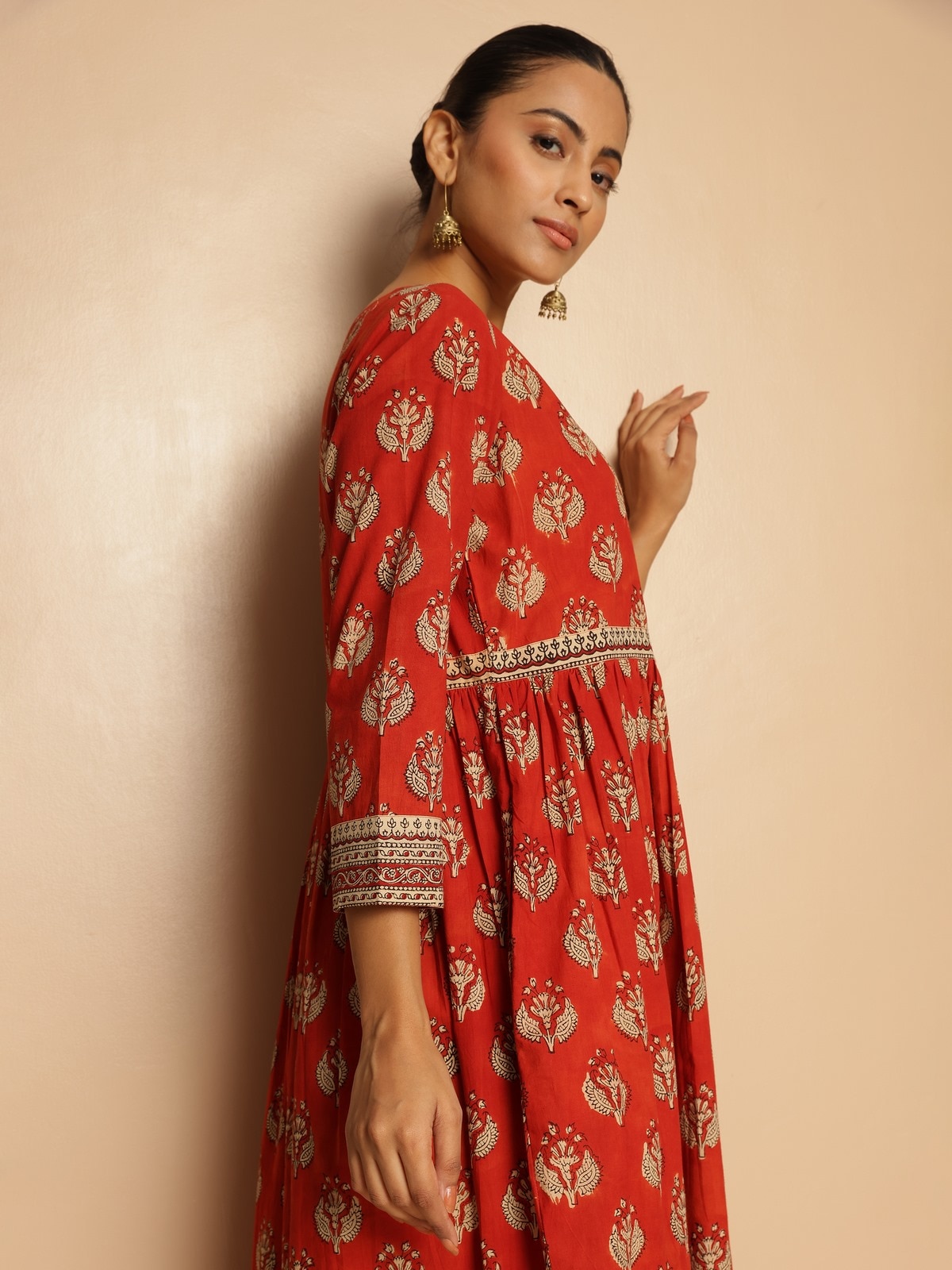 Side lifestyle view of red Bagru kurta highlighting flow and comfort