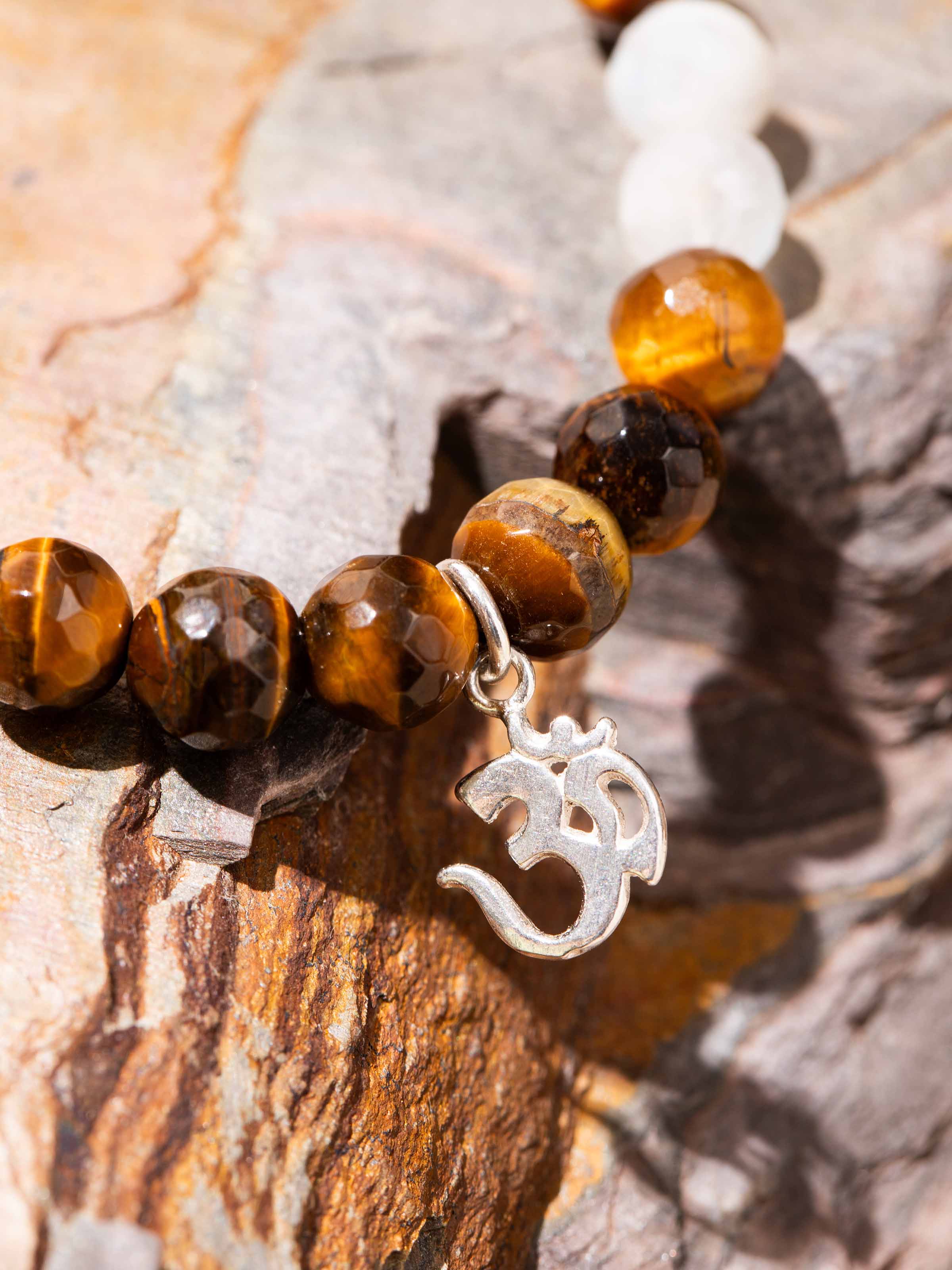 Angled view of Tiger Eye & White Moonstone Bracelet focusing on polished surface and handcrafted design