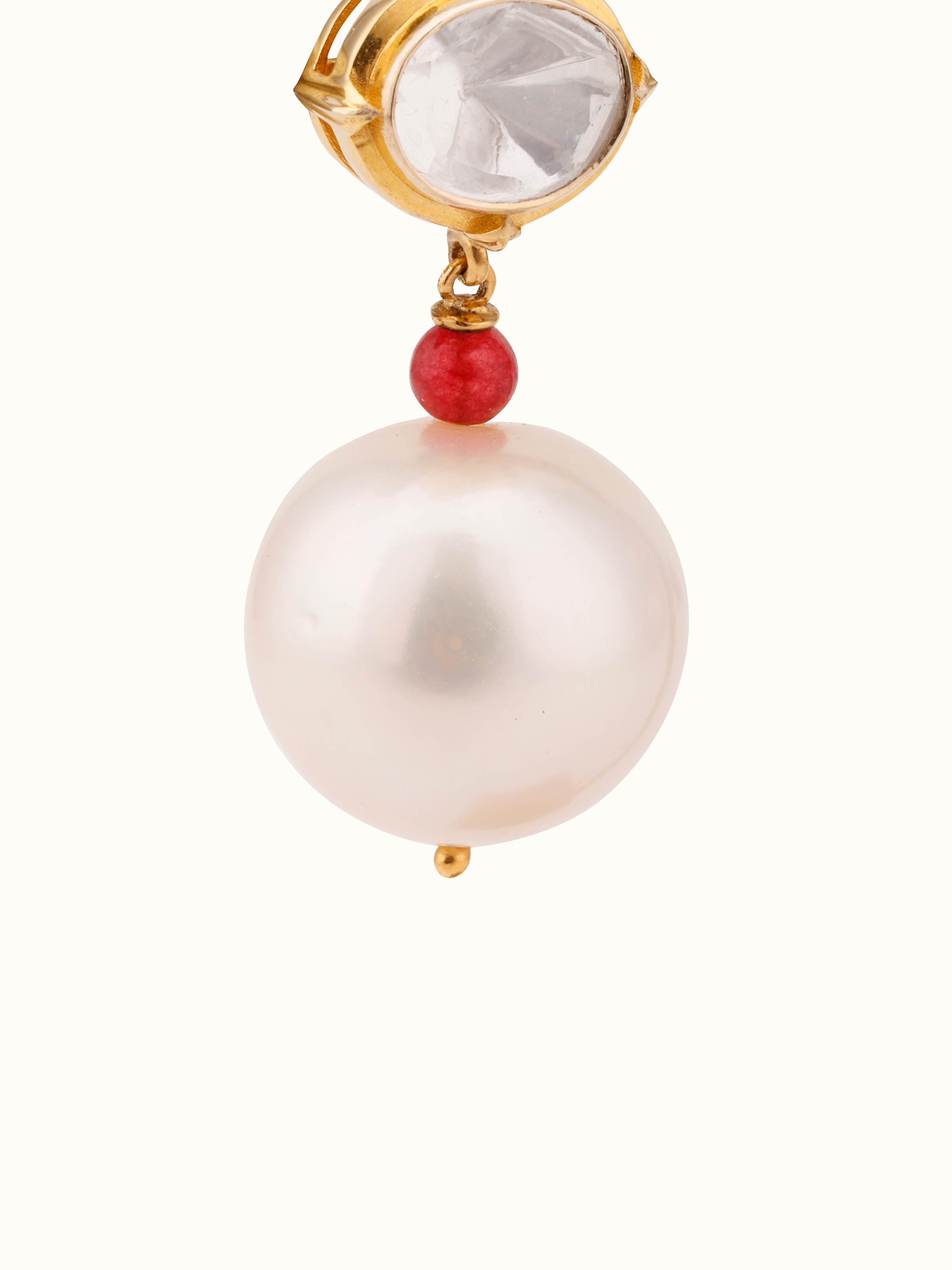 Detailed view of Polki gold drop earrings with polished gold finish and uncut diamonds