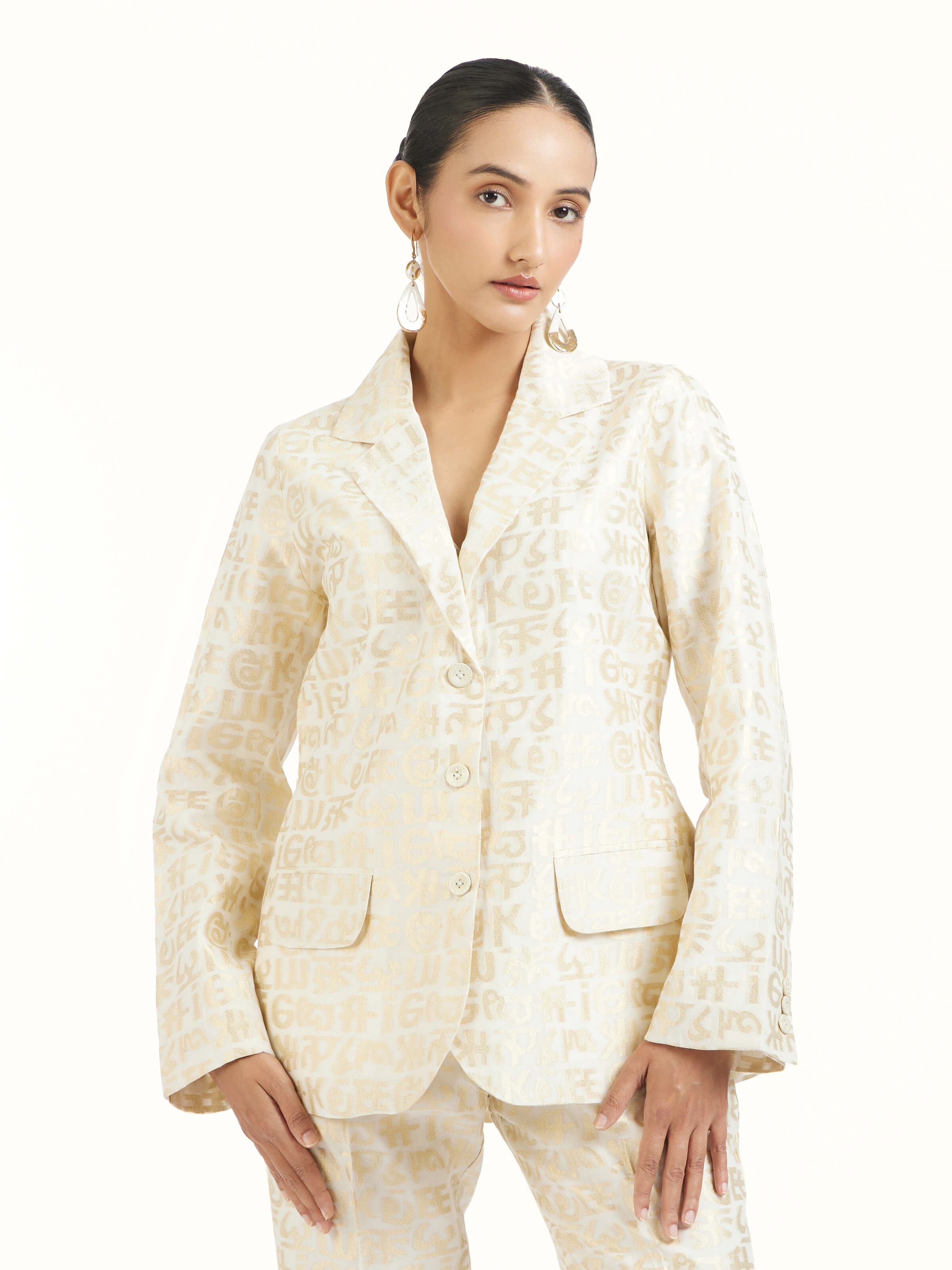 Angled view of ivory handloom cut work calligraphy co-ord set emphasizing cut work detailing