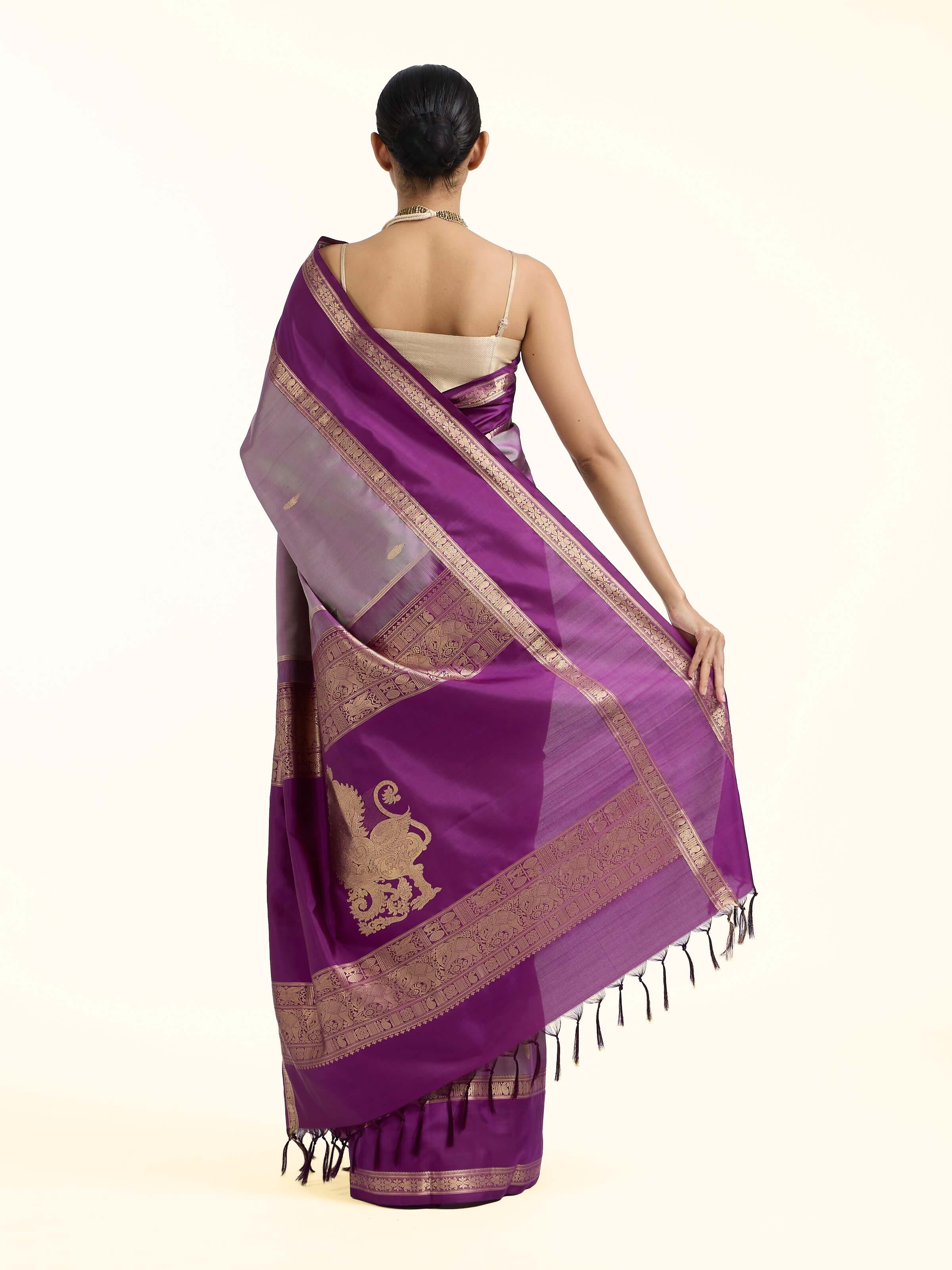 Back view of purple silk Kancheepuram saree displaying ornate pallu design