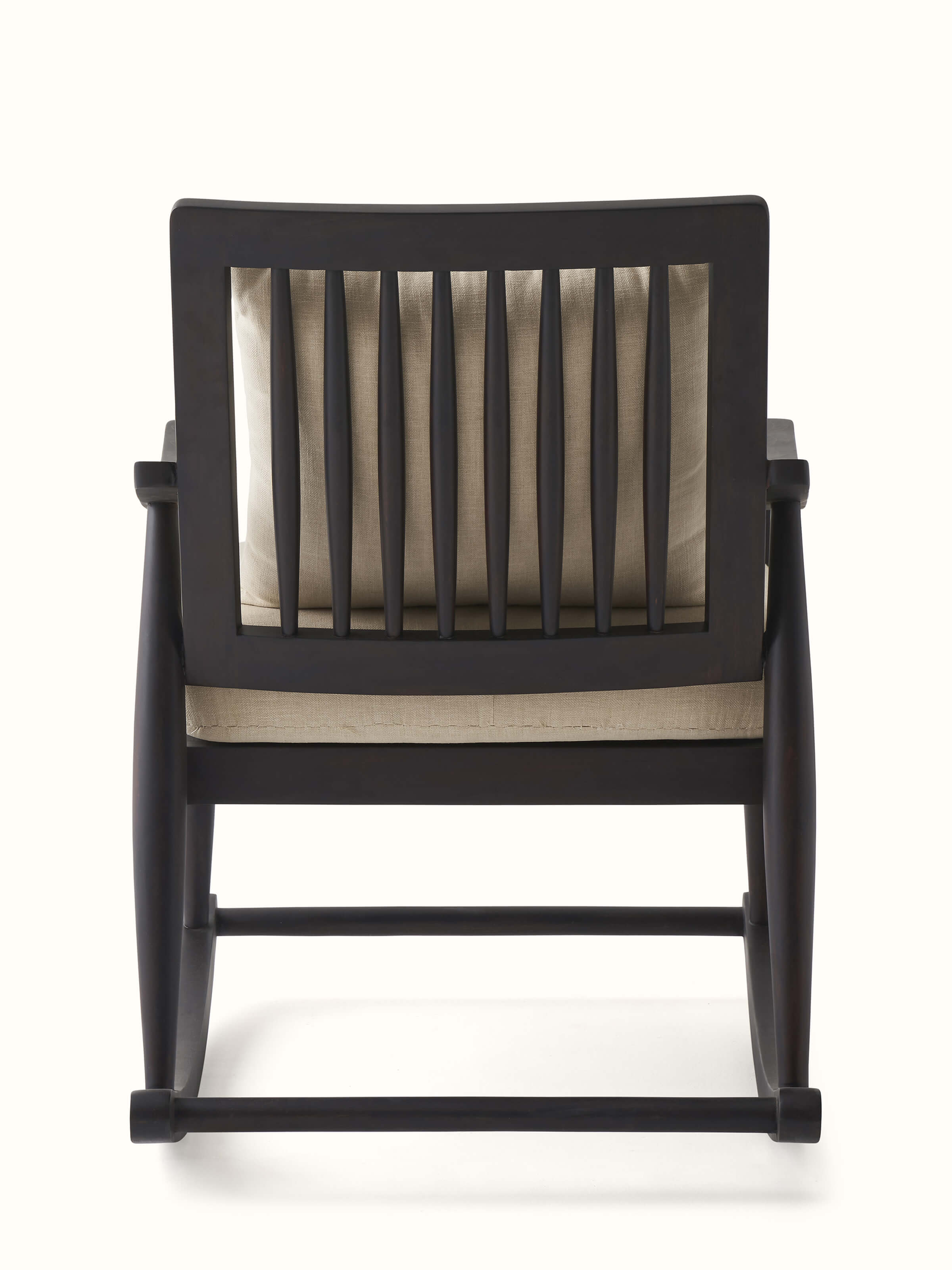 Rocking mechanism of the Sheesham wood and brass tarkashi chair, focusing on the smooth and sturdy construction for comfortable use.