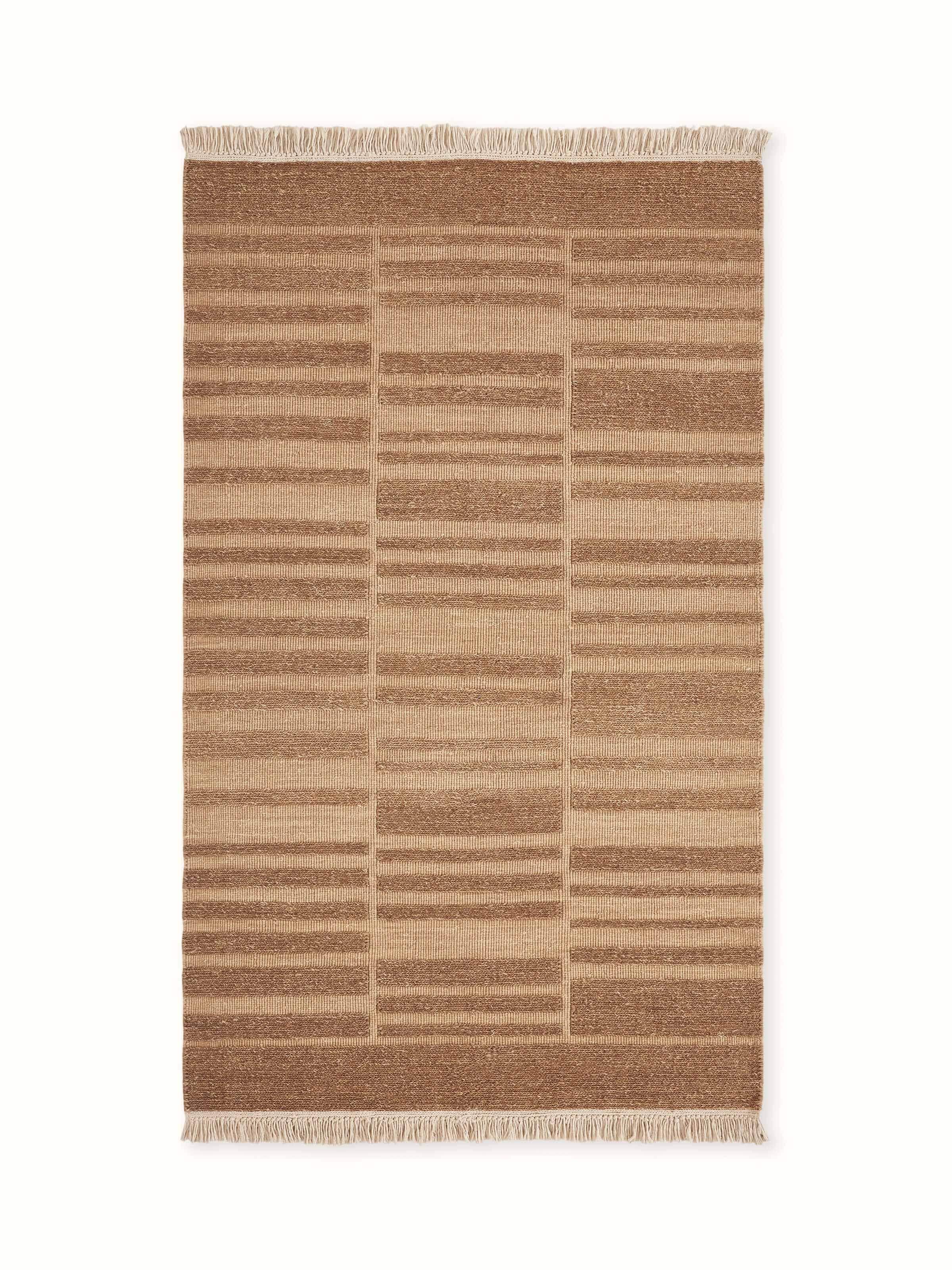 Front view showcasing the geometric multi-textured design in warm brown tones on the Bhadohi wool rug