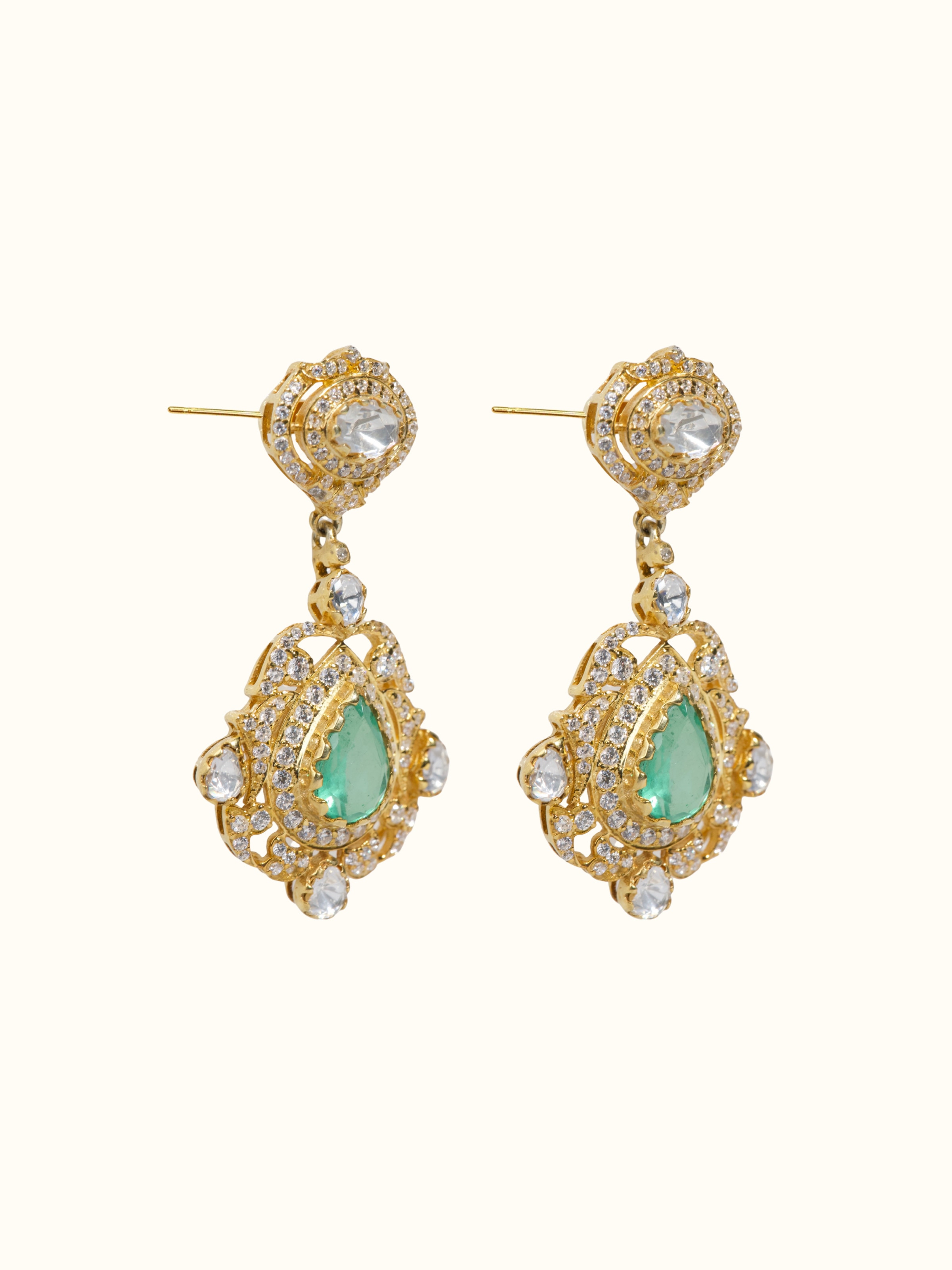 Angled view of silver smithing drop earrings