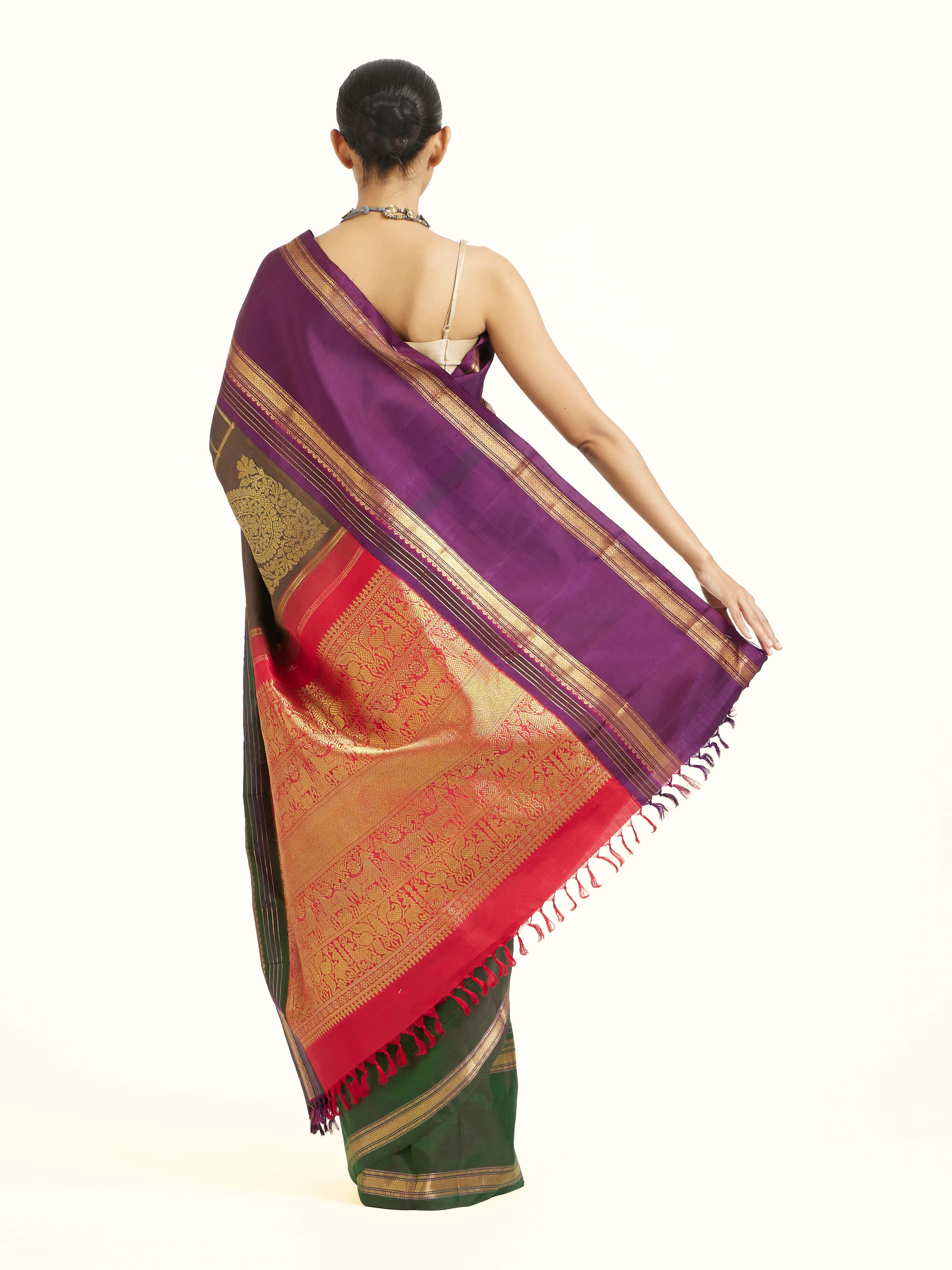 Back view of black silk Kancheepuram saree displaying ornate pallu design