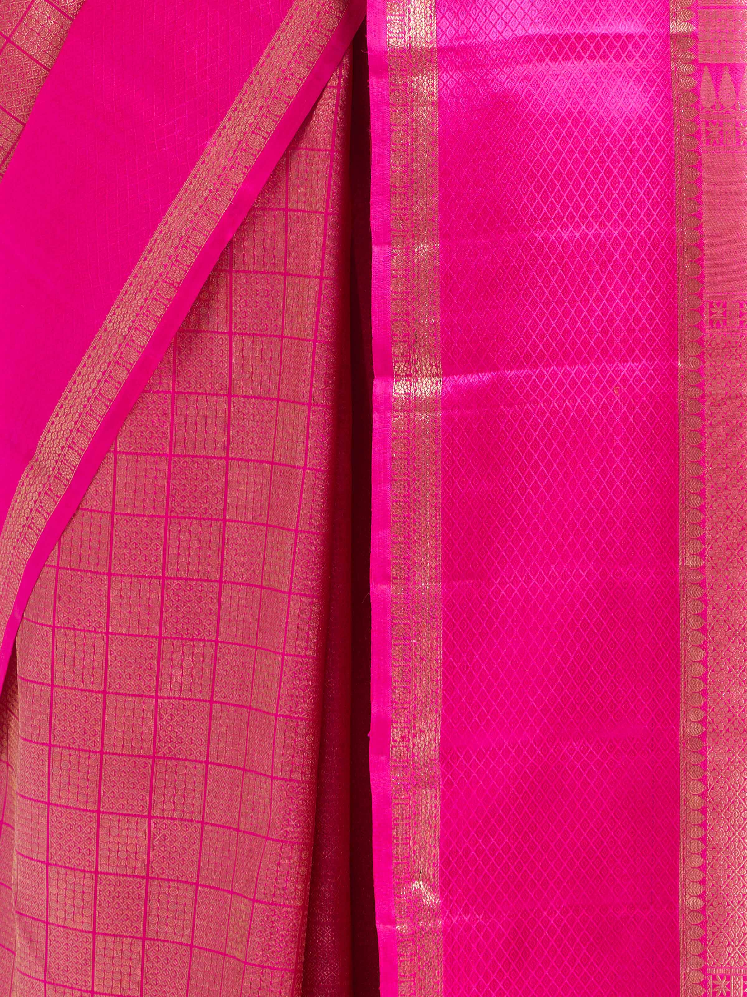 Detail view of pink silk Kancheepuram saree showing silk texture and zari craftsmanship