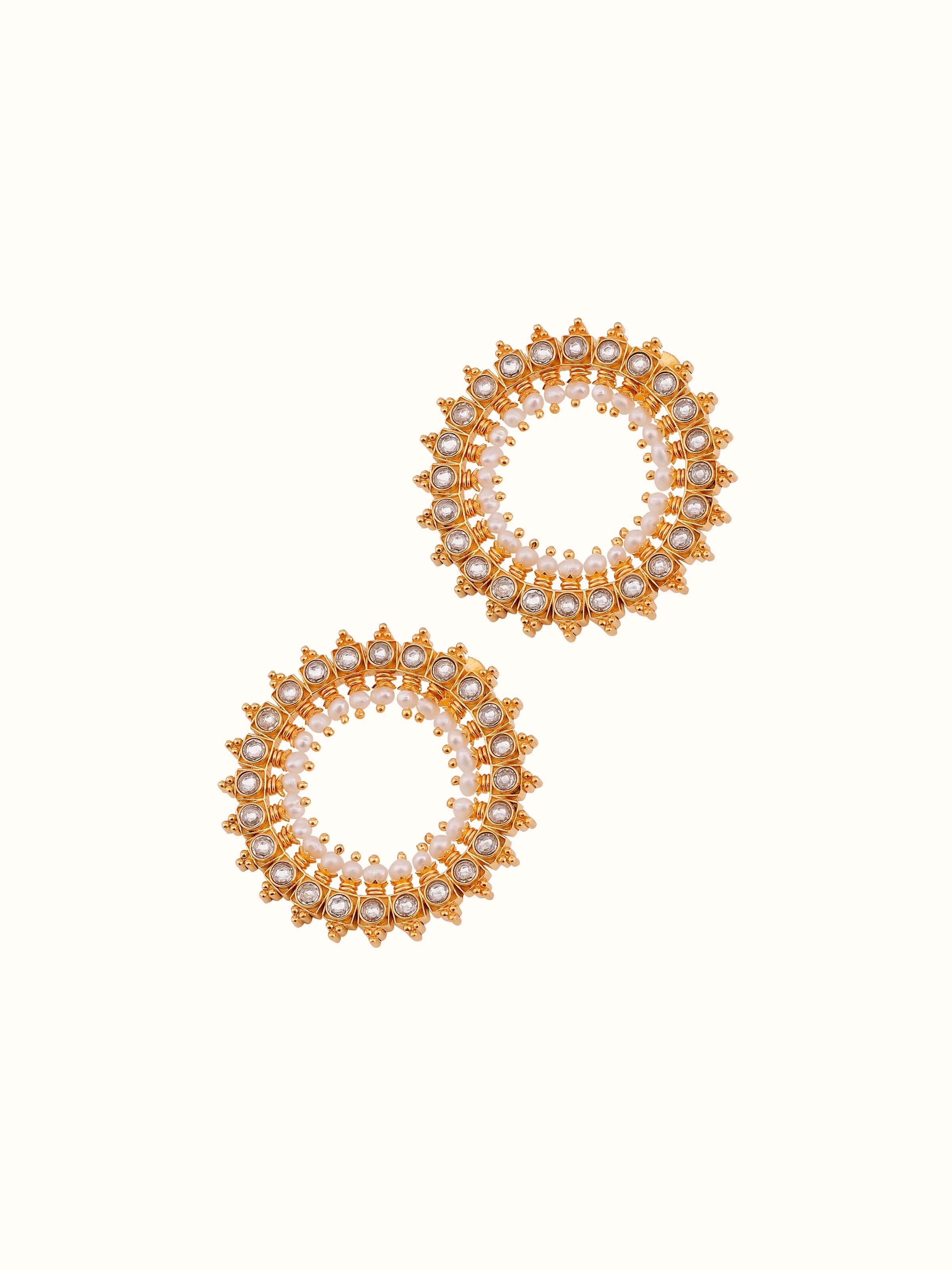 Overhead view of Guttapusalu silver studs showing symmetrical layout and handcrafted details.