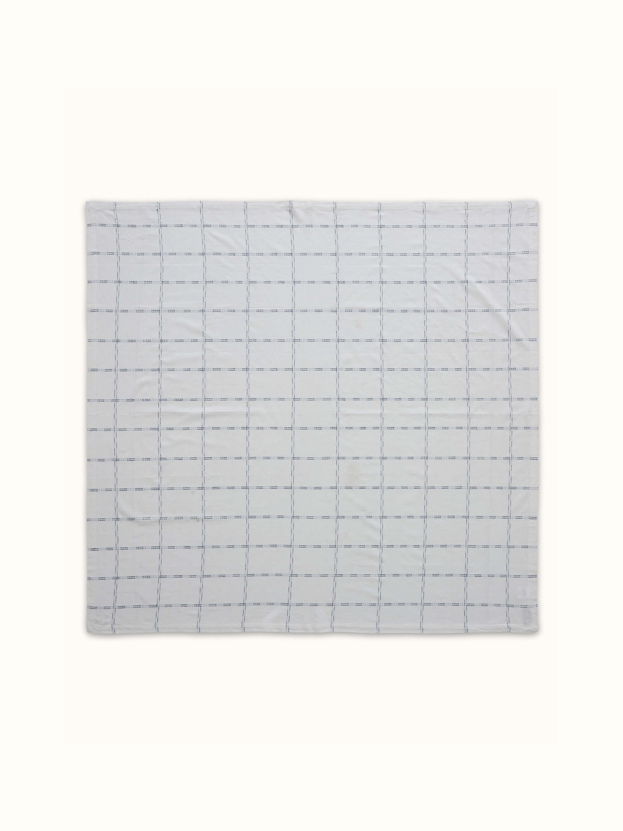 Full view displaying the indigo checks pattern across the table cover