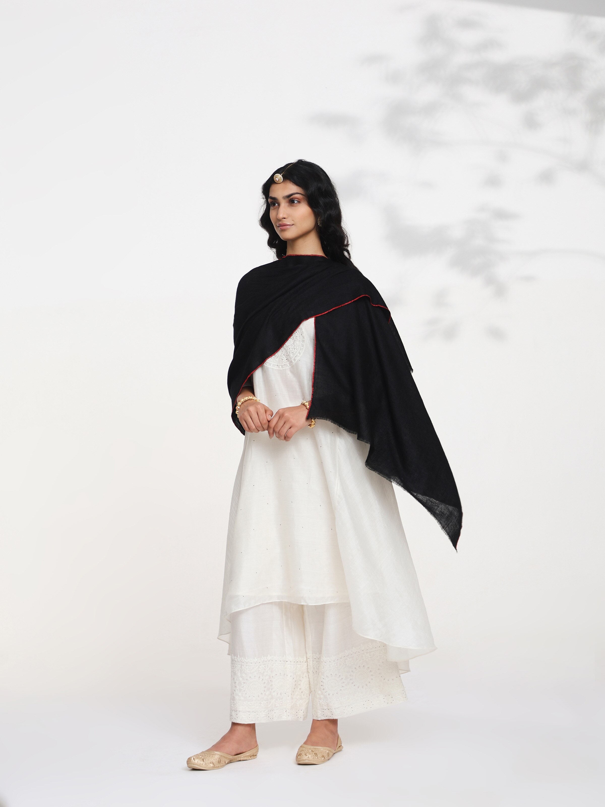Side view of black cashmere kaaj embroidered handwoven stole highlighting soft drape