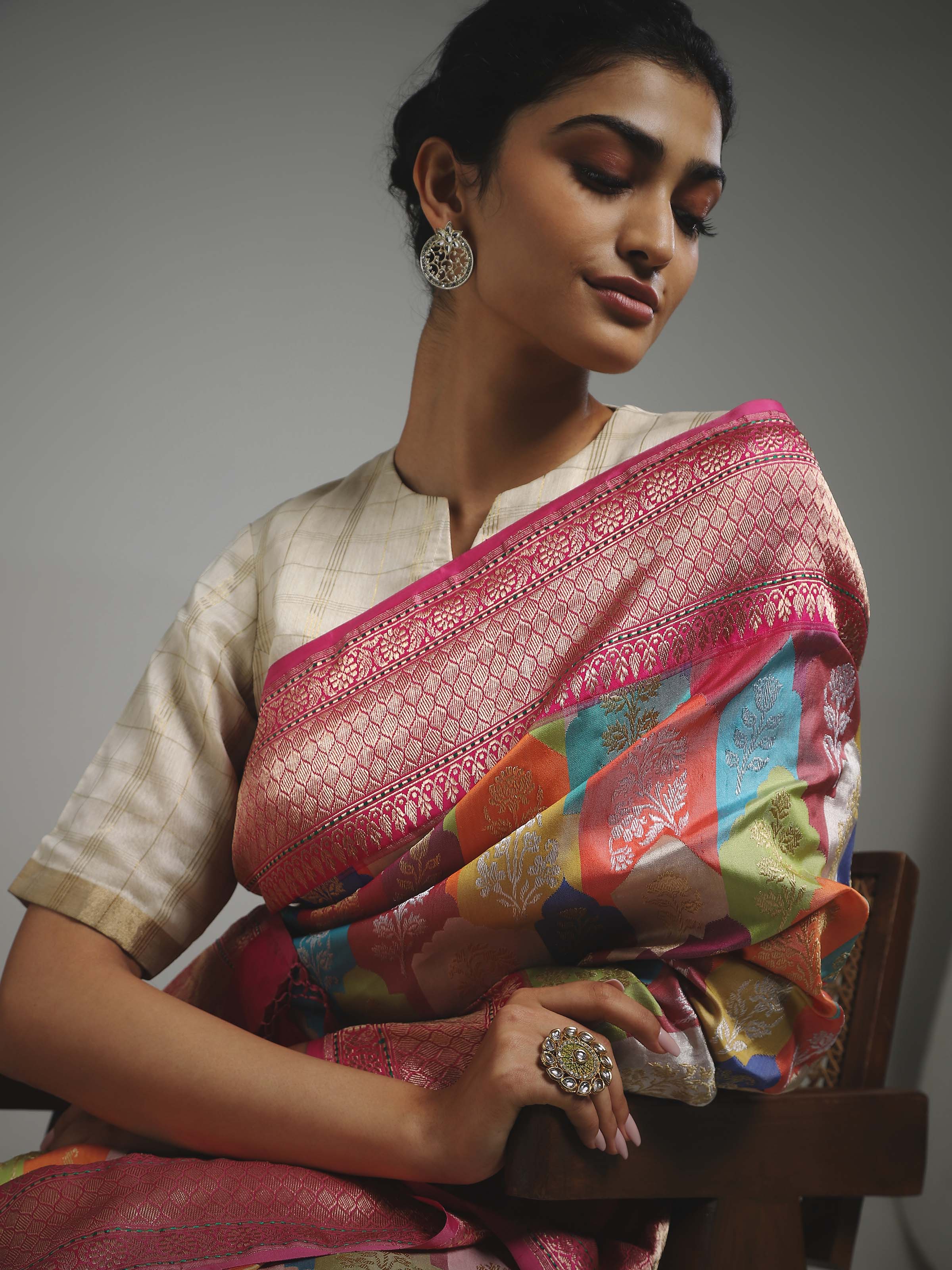 Side view of silk Banarasi saree with ornate border and motifs